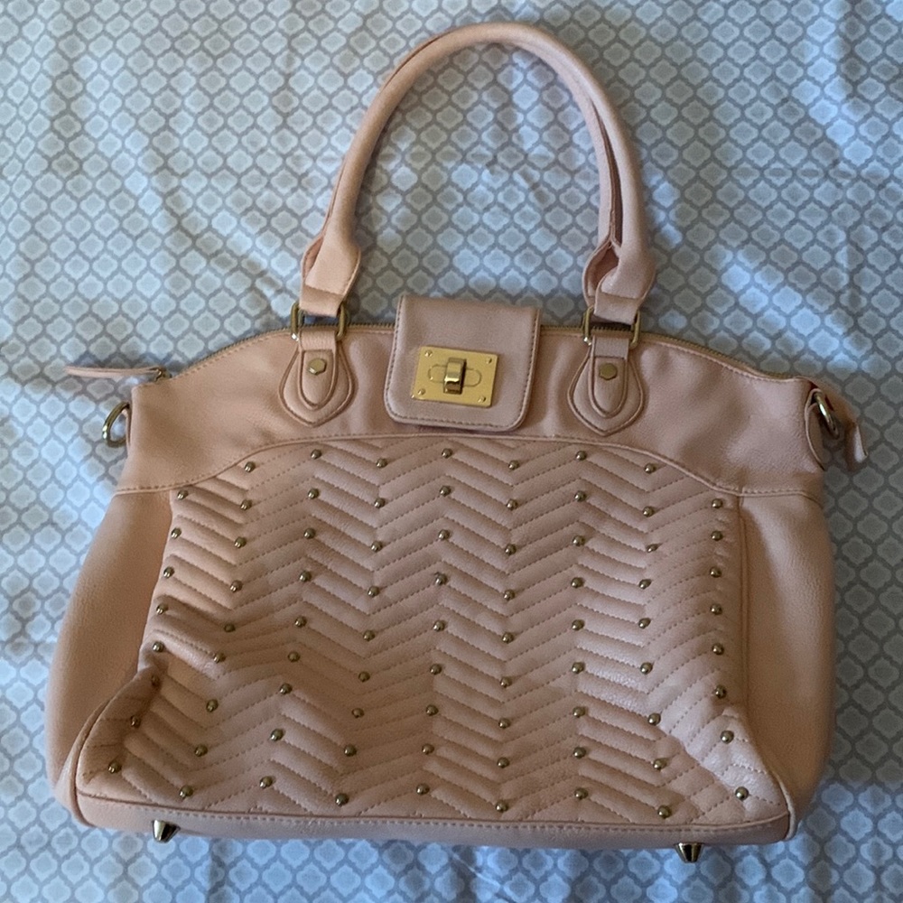 Light Pink Purse with additional cross body strap. Studded design on front.